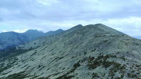 Aerial view from drone on mountain forest and peak of blue rock range. Video stock 141026543