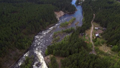 Aerial view from the drone. Mountain river flows among the dense taiga forest. Stock Footage 104633490