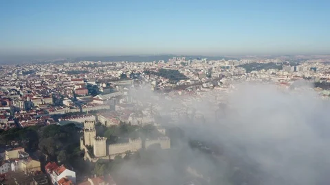 Aerial view; drone moves down in the mist over the rooftops Stock Footage 105292582