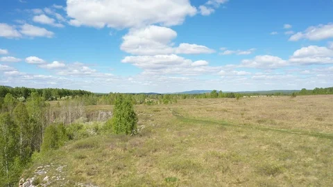 Aerial view; drone moving backward down opposite stone slope Stock Footage 109330094