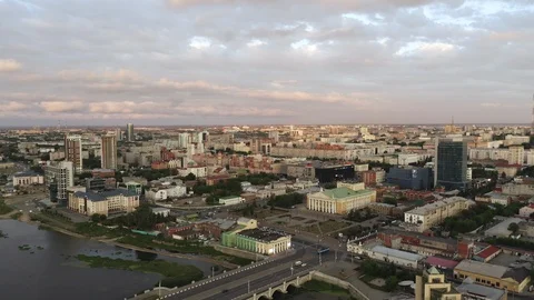 Aerial view; drone moving backward over the miass river in Chelyabinsk Stock Footage 112042428