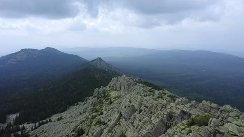 Aerial view. drone moving backward near rocky cliff Video stock 114165616