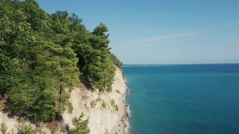 Aerial view; drone moving forward over beautiful seashore Stock Footage 123202527