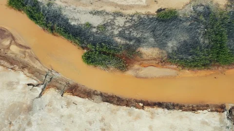 Aerial view; drone moving over the very polluted river, Karabash Stock Footage 112779842