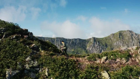Aerial view; drone moving over young man Stock Footage 117415237