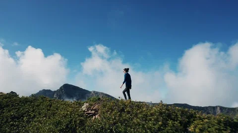 Aerial view; drone moving over young woman Stock Footage 117415474