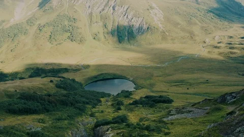Aerial view; drone moving over mountain lake Stock Footage 118436622