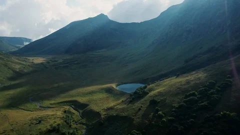 Aerial view; drone moving over mountain lake Stock Footage 118437336