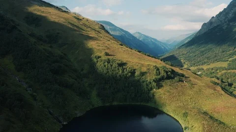 Aerial view; drone moving over mountain lake Stock Footage 118438924