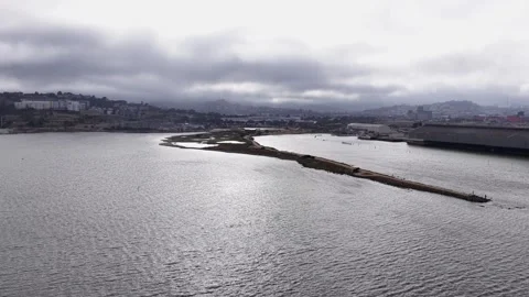 Aerial View Drone Orbit of Heron's Head Park, San Francisco Waterfront, Cloudy Stock Footage 338429292
