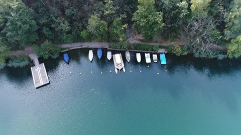 Aerial view with drone over a blue lake in Val Camonica Italy Stock Footage 99729238