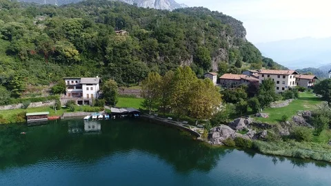 Aerial view with drone over a blue lake in Val Camonica Italy Stock Footage 99729246