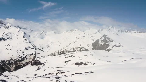 Aerial view drone panorama over the snowy peaks of the Caucasus mountains Stock Footage 196988048