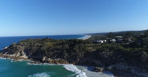 Aerial view by drone rising to reveal North Stradbroke Island Beach waves and Stock Footage 78328115