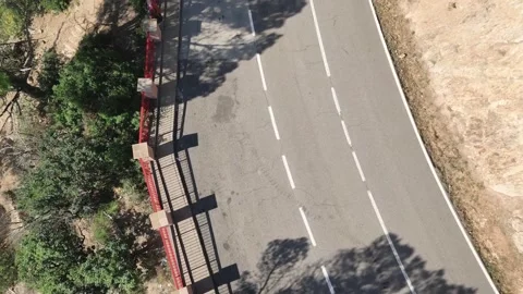 Aerial view from drone of road between green trees, 4K Stock Footage 266937442