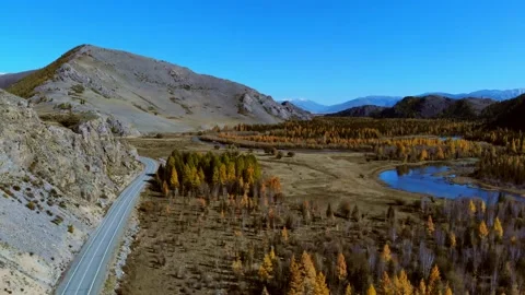 Aerial view of the drone on the road, forest, mountains river. Altay. Russia Video stock 140254401