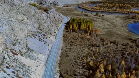 Aerial view of the drone on the road, forest, mountains river. Altay. Russia Video stock 140254802