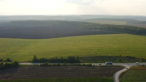 Aerial view from a drone of section of the road delivery trucks and cars drive Video stock 194514039