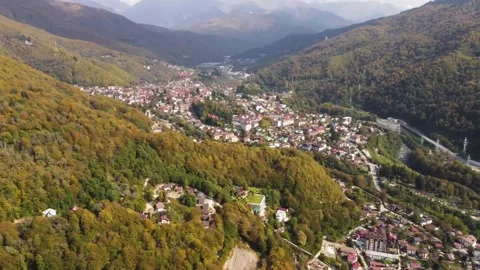 Aerial view from a drone of a settlement at the foot of the mountains. Stock Footage 169653755