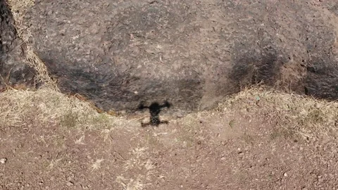 Aerial View of Drone Shadow Flying over Rocks 스톡 동영상 130490118