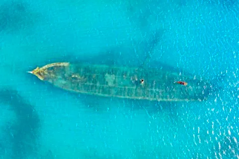 Aerial view by drone of a shipwreck in the shallow water of blue Caribbean Sea, Stock Photos