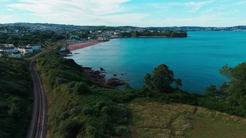 Aerial view drone shot of devon coastine, and historical railway line. Stock Footage 337880813