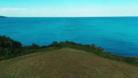 Aerial view drone shot of devon sea and the horizon with ships in the distance Stock Footage 337880814
