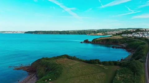 Aerial view drone shot of devon coastline, railway, sea and housing Stock Footage 337880821
