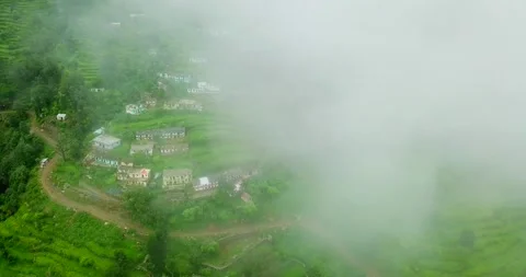 Aerial view drone shot fly in clouds in village of uttrakhand Stock Footage 219610731
