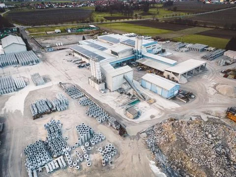 Aerial view, drone shot large open storage site of a private owned construction Stock Photos