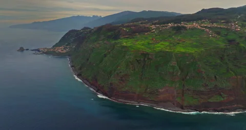 Aerial view by drone steep cliffs over the Atlantic ocean, where land meets Stock Footage 271052810