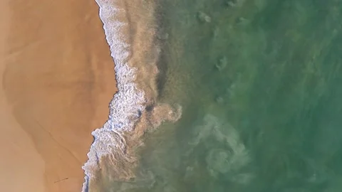 Aerial view of drone. Sunsets over sea. Beautiful sea waves. Beach sand and amaz Vídeo Stock 143003129