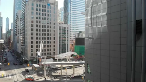 Aerial view of drone taking off between buildings Stock Footage 143154676