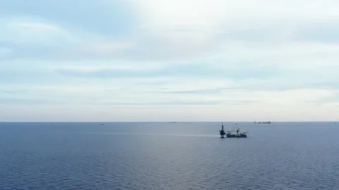 An aerial view from a drone of  a tender drilling oil rig Stock Footage 238568855