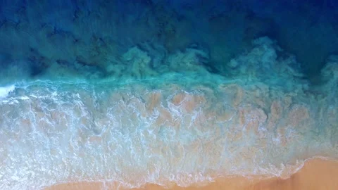 Aerial view of drone top view beach sea sand. Seawater wave and surf on sandy be Stock Footage 143192926