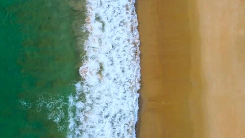 Aerial view of drone top view beach and crystal seawater on sandy beach  Vídeo Stock 172386544