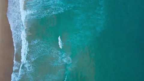 Aerial view of drone. Top view of seawater wave in nature on sandy beach. In sun Stock Footage 173023842