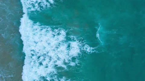 Aerial view of drone. Top view of seawater wave in nature on sandy beach. In sun Stock Footage 173024239