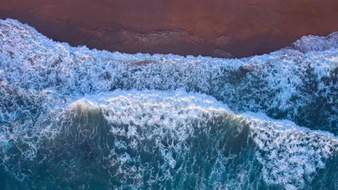 Aerial view of drone. Top view of seawater wave in nature on sandy beach. In sun Stock Footage 173068820