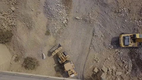 Aerial view with drone of a tractor moving debris 스톡 동영상 143937018