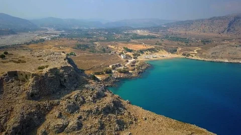 Aerial View: Drone video of iconic beach of Agathi and castle of Feraklos, Rodos Stock Footage 80579728