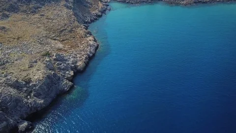 Aerial View: Drone video of iconic beach of Agathi and castle of Feraklos, Rodos Stock Footage 80579998
