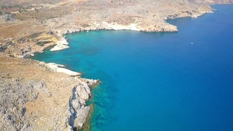 Aerial View: Drone video of iconic beach of Agathi and castle of Feraklos, Rodos Stock Footage 80582049