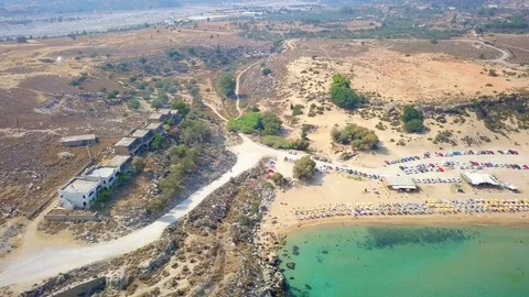 Aerial View: Drone video of iconic beach of Agathi and castle of Feraklos, Rodos Stock Footage 80582199