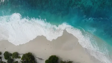 Aerial View Drone Video of waves crashing on the beach in Fuvahmulah in Maldives Stock Footage 146180894