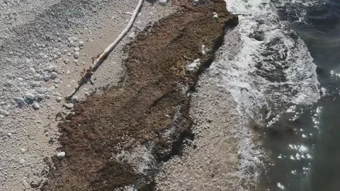 Aerial view from the drone of the waves breaking on a beach in Bisceglie, nea Stock Footage 164774625