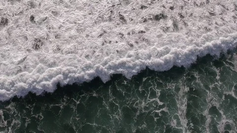 Aerial View Dropping Down on Waves Crashing Stock Footage 84746671
