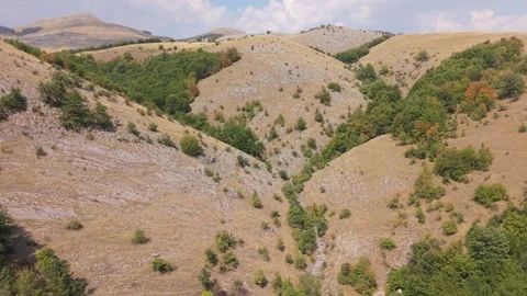 Aerial View Drought Affected Rolling Hills Visocica Mountain Dry Yellow Grass  Stock-Footage 343151804