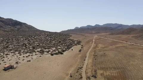 Aerial View of dry empty spanish desert with vegetation and mountains in Vídeos de archivo 119351404