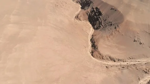 Aerial view of dry river between sand desert rock mountains Atacama Chile. Drone Stock Footage 93788721